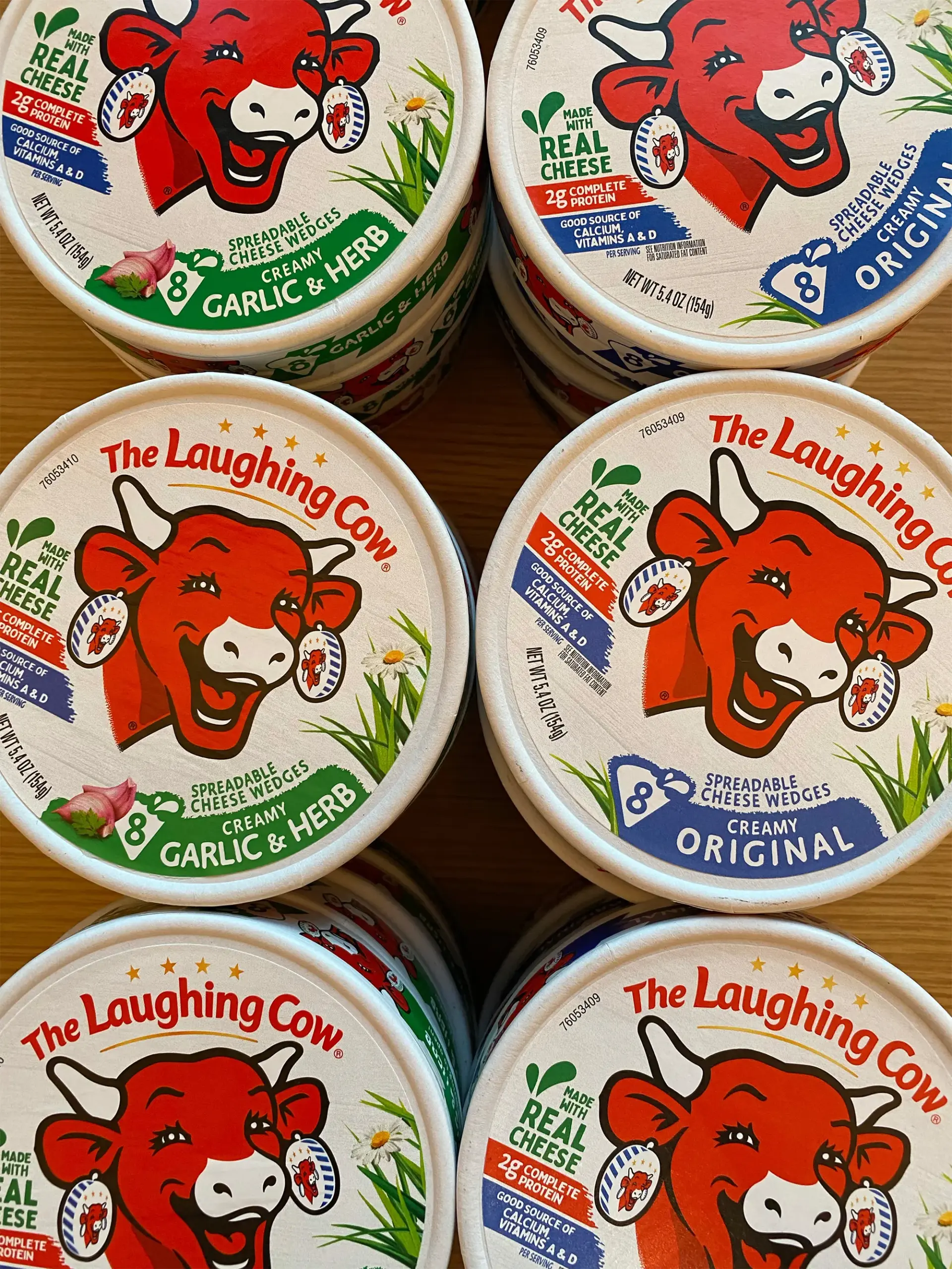 An overhead view of wheels of Laughing Cow cheese