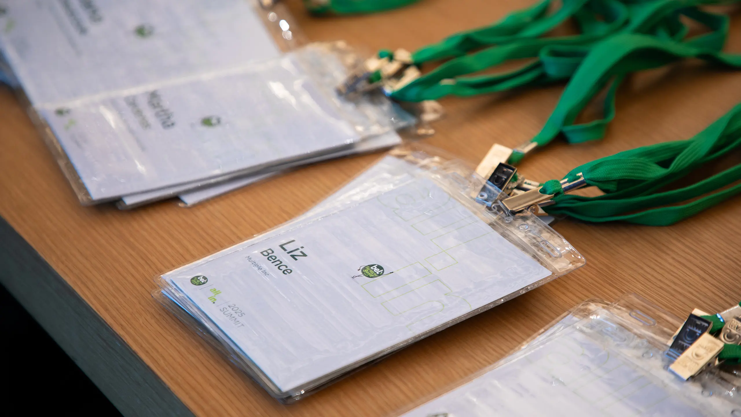 Nametags displayed on a table at ‘All In 2025’