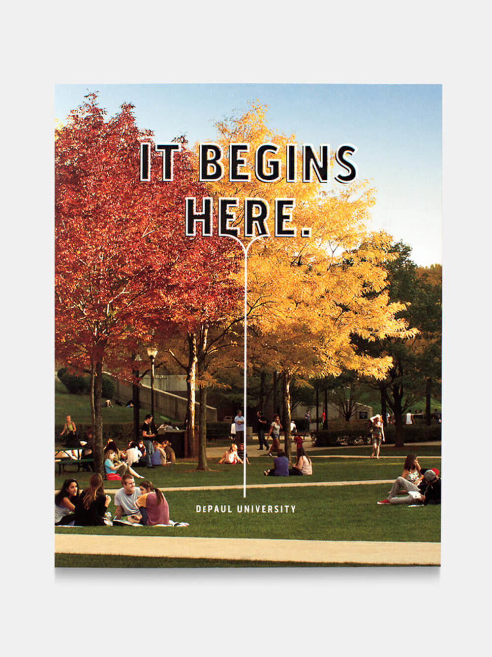 A vibrant college campus scene features students relaxing on a grassy lawn. Autumn trees in red and yellow frame the backdrop. Text reads "It Begins Here" at DePaul University.